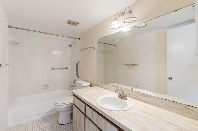 full bathroom featuring toilet, vanity, tile patterned flooring, and tiled shower / bath