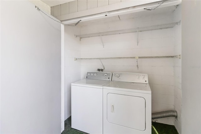 clothes washing area with washer and dryer