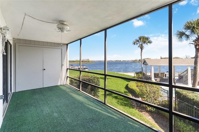 unfurnished sunroom with a water view and plenty of natural light