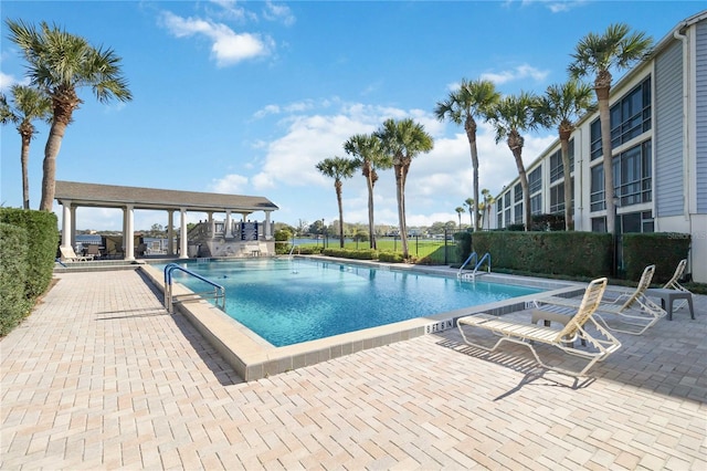 view of swimming pool featuring a patio area