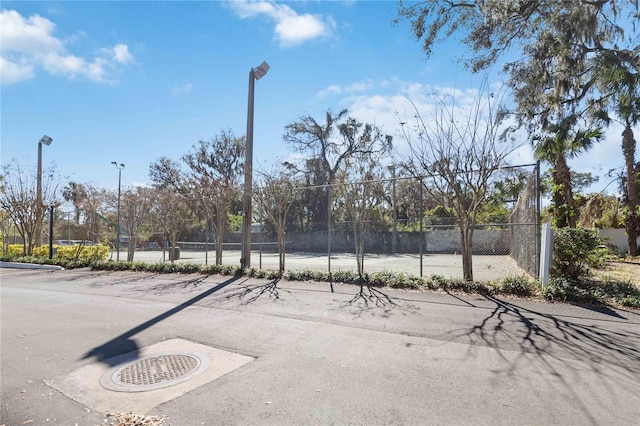 surrounding community featuring tennis court