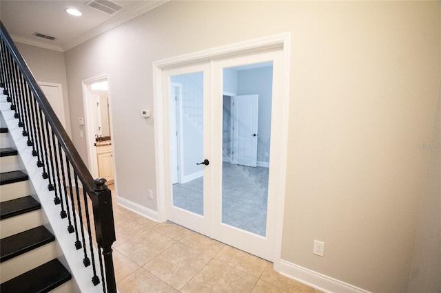 staircase featuring ornamental molding, french doors, visible vents, and baseboards