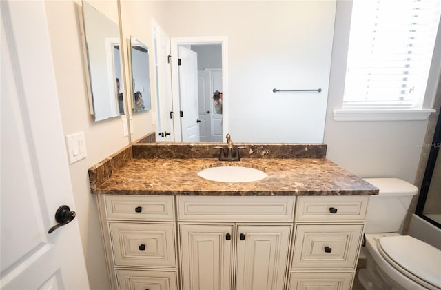 bathroom with vanity and toilet