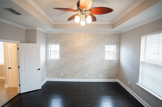 spare room featuring visible vents and wallpapered walls