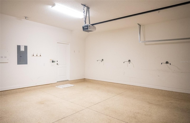 garage with electric panel, baseboards, and a garage door opener