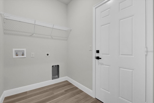 laundry room with laundry area, baseboards, wood finished floors, hookup for a washing machine, and hookup for an electric dryer