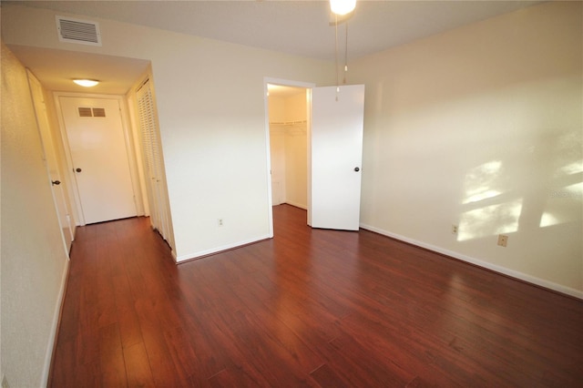 6026 22nd Ave N Unit 4, Saint Petersburg, FL 33710 - empty room with dark hardwood / wood-style flooring