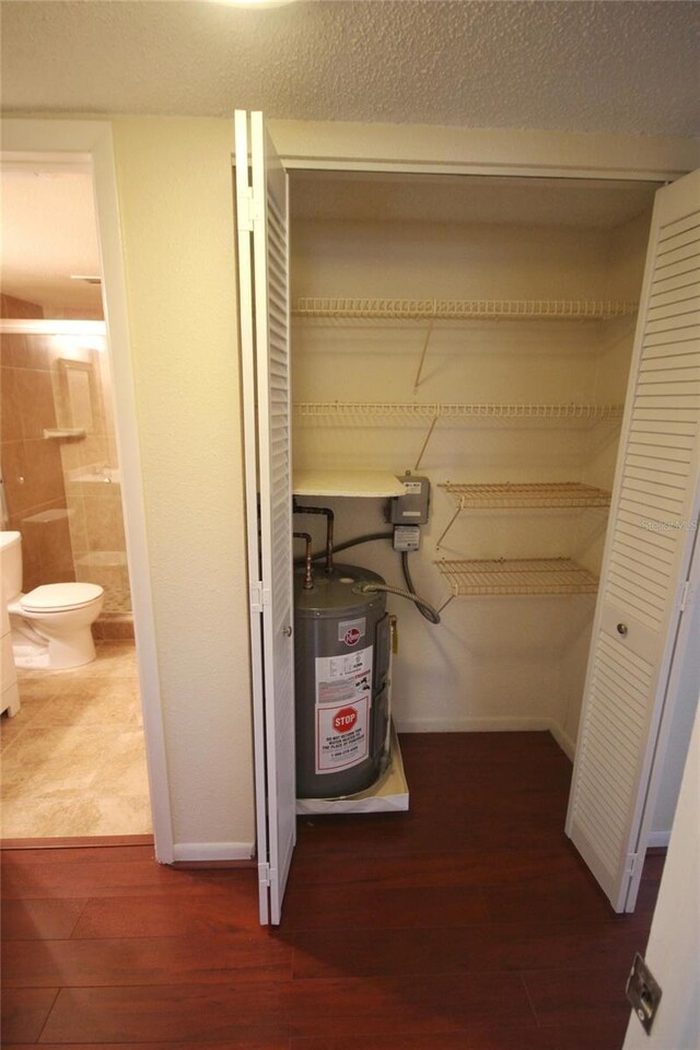 6026 22nd Ave N Unit 4, Saint Petersburg, FL 33710 - utility room with water heater