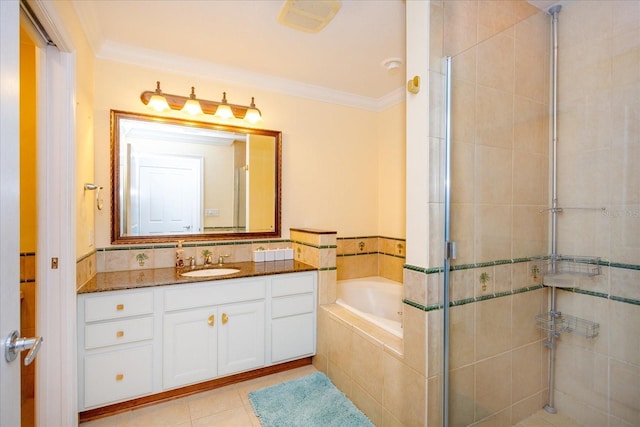 bathroom with vanity, ornamental molding, a bath, tile patterned floors, and a stall shower