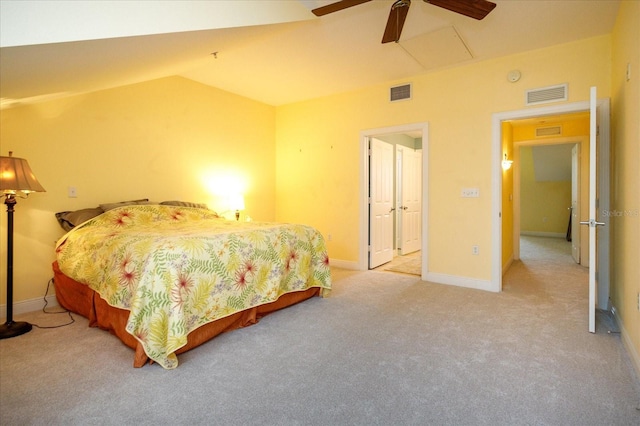 bedroom featuring lofted ceiling, light carpet, visible vents, and baseboards