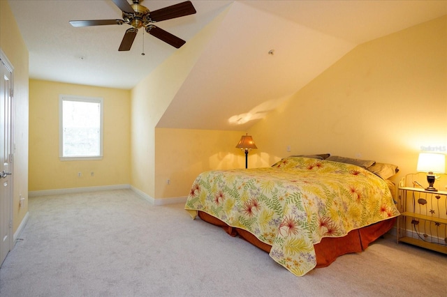 bedroom with vaulted ceiling, ceiling fan, carpet, and baseboards