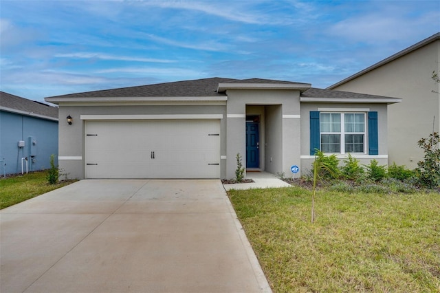 view of front of property featuring a garage and a front yard