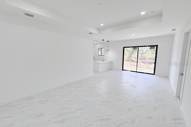 empty room with a tray ceiling