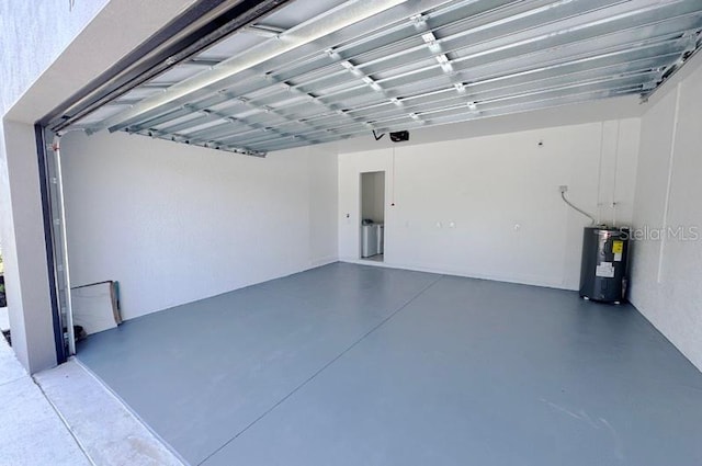 garage featuring a garage door opener and water heater