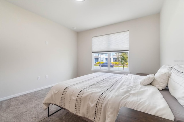 carpeted bedroom with baseboards