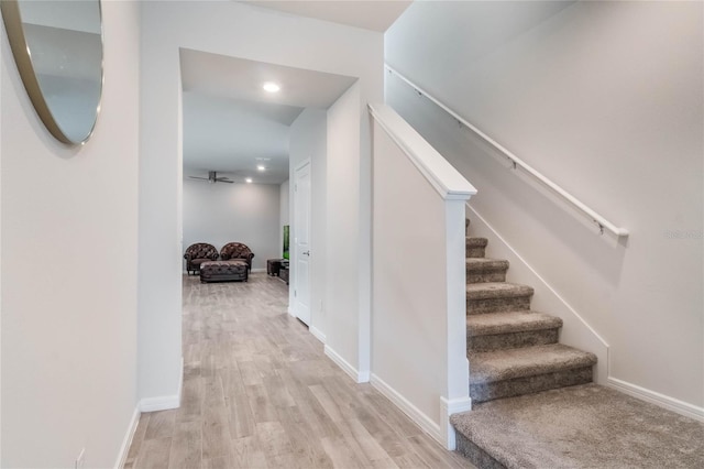 interior space with baseboards and wood finished floors