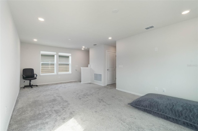 interior space with recessed lighting, visible vents, and light colored carpet