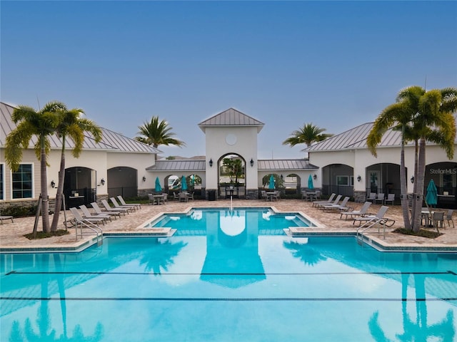 community pool with a patio