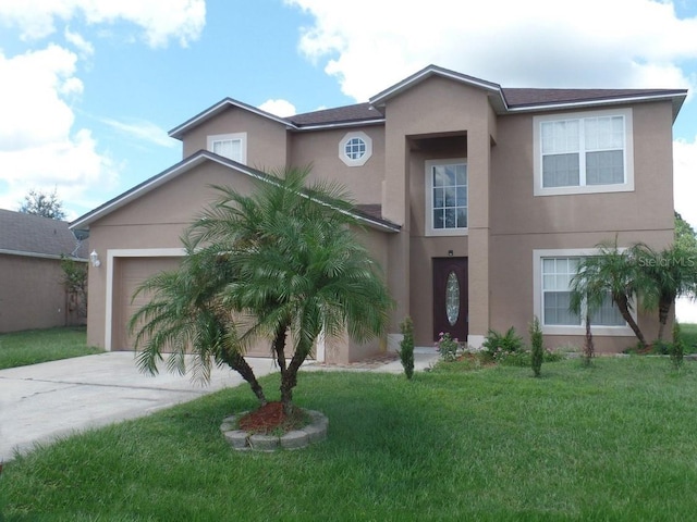 traditional home featuring driveway, a front lawn, an attached garage, and stucco siding