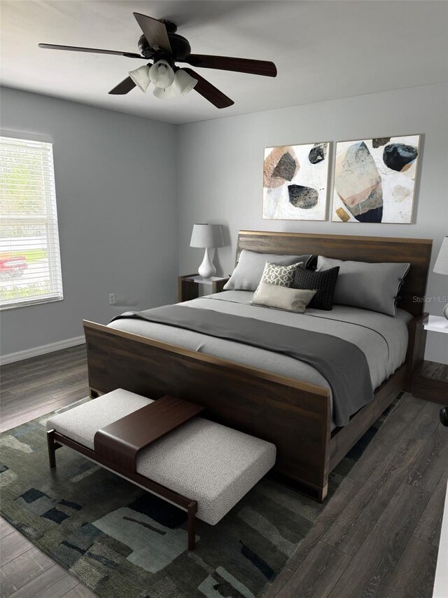 bedroom featuring ceiling fan, baseboards, and wood finished floors