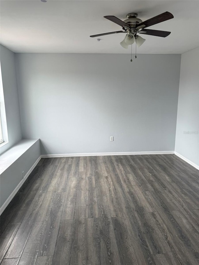 unfurnished room with a ceiling fan, baseboards, and wood finished floors