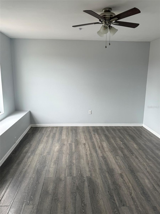 unfurnished room featuring ceiling fan, baseboards, and wood finished floors