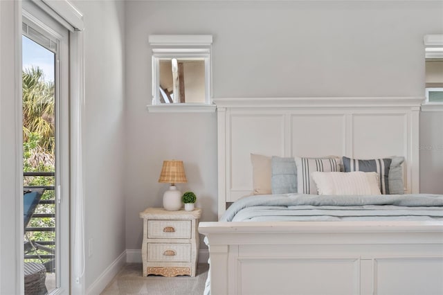 bedroom with a wainscoted wall and a decorative wall