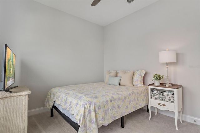 bedroom featuring a ceiling fan, carpet, and baseboards