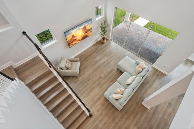 interior space with wood finished floors and baseboards