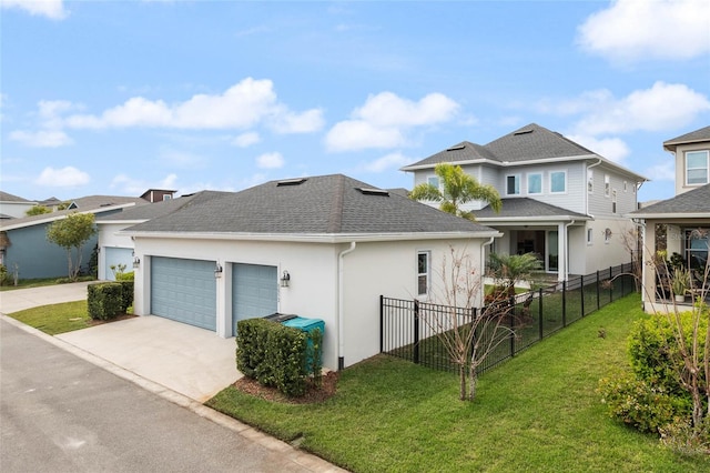 view of front facade with a shingled roof, fence, driveway, stucco siding, and a front lawn