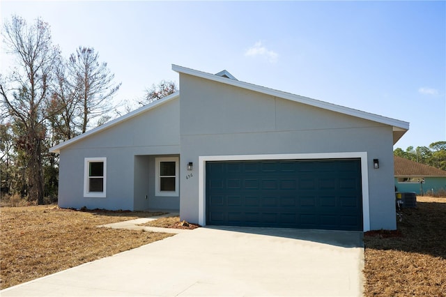 view of front of house featuring central AC unit and a garage