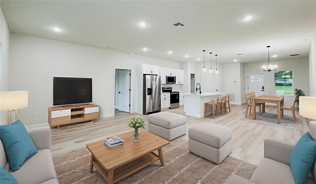 656 Marion Oaks Mnr, Ocala, FL 34473 - living area featuring light wood-type flooring, recessed lighting, and a chandelier
