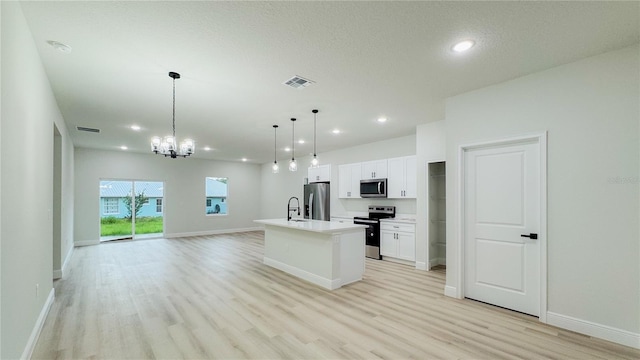 656 Marion Oaks Mnr, Ocala, FL 34473 - kitchen with stainless steel appliances, light wood-style flooring, white cabinetry, open floor plan, and recessed lighting