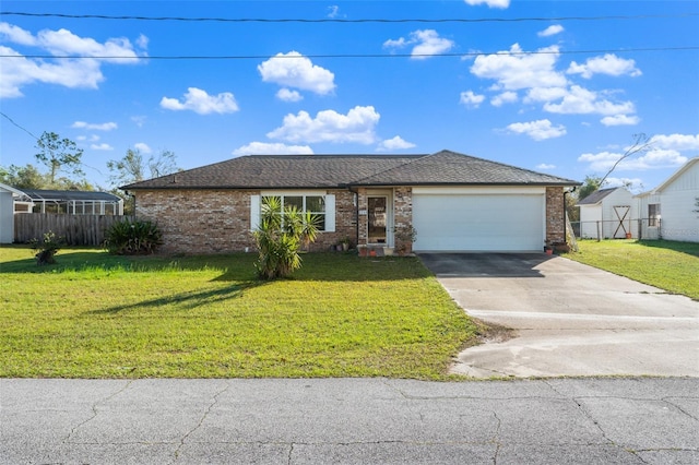 single story home featuring a front yard and a garage