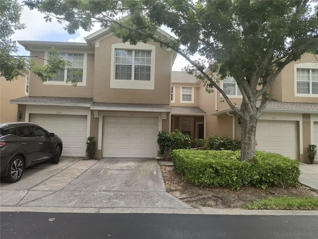 townhome / multi-family property featuring a garage