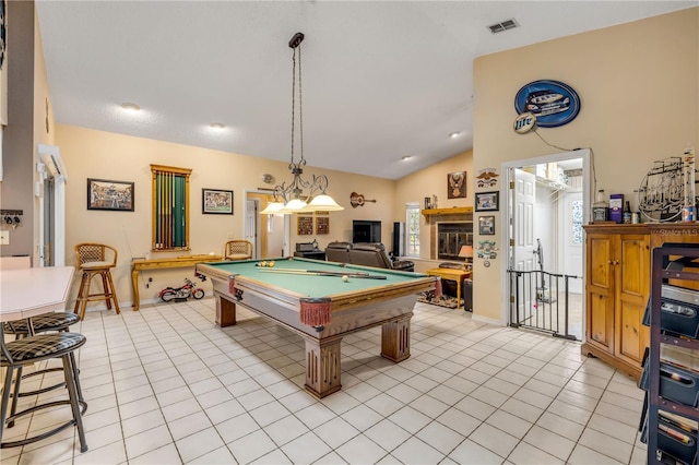 recreation room featuring lofted ceiling, pool table, a wealth of natural light, and light tile patterned floors