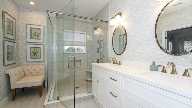 bathroom featuring tile patterned floors, vanity, and walk in shower