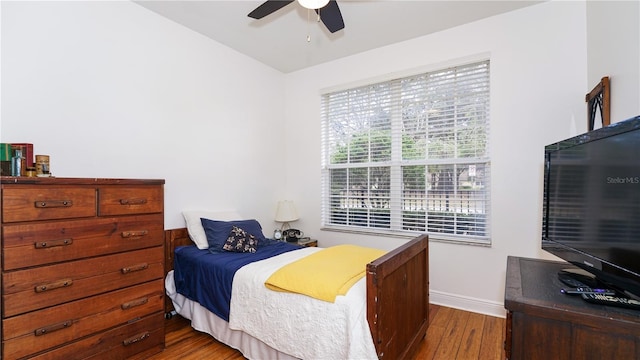 bedroom featuring ceiling fan and dark hardwood / wood-style flooring