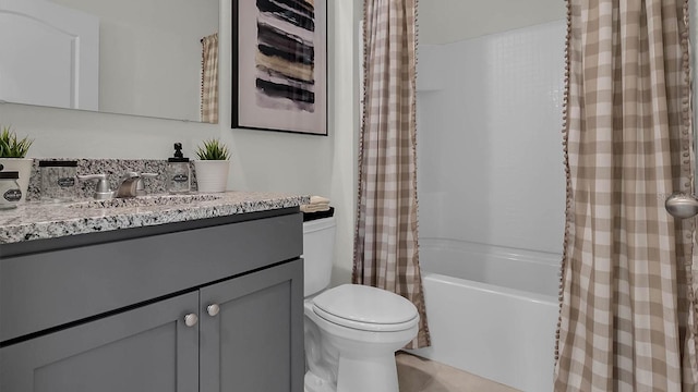 full bathroom with toilet, vanity, and shower / bath combination with curtain