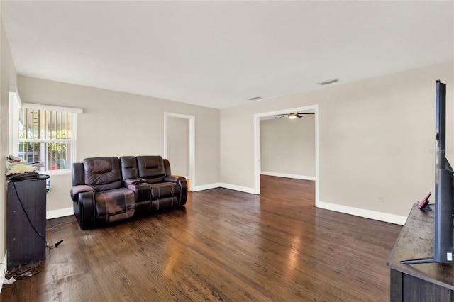 living room featuring dark hardwood / wood-style flooring