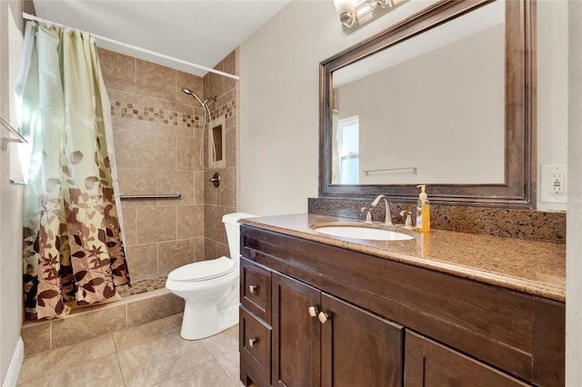 bathroom with toilet, vanity, and walk in shower