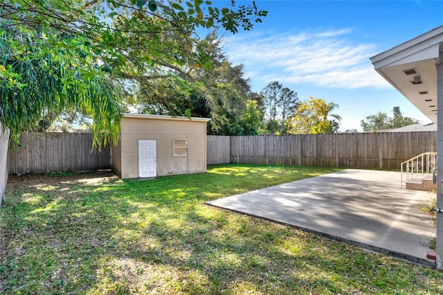 view of yard with a shed and a patio