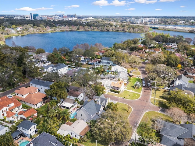 birds eye view of property with a water view and a residential view