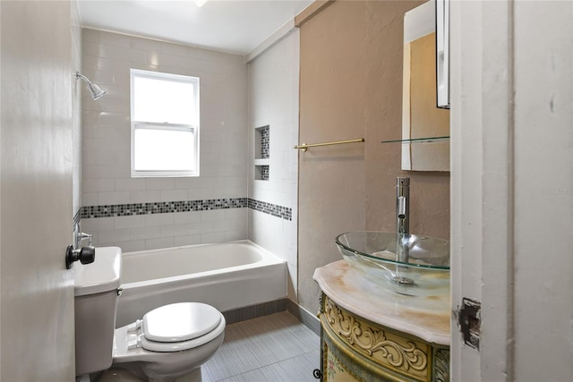 bathroom featuring shower / washtub combination, tile patterned flooring, vanity, and toilet