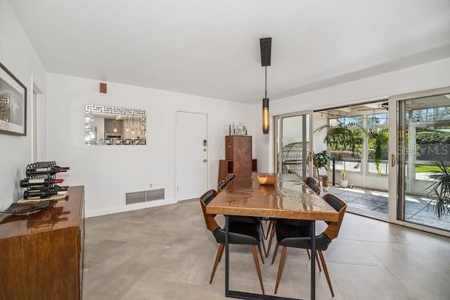 dining room with visible vents and baseboards