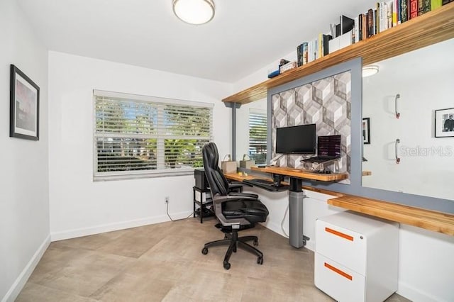 office space featuring baseboards