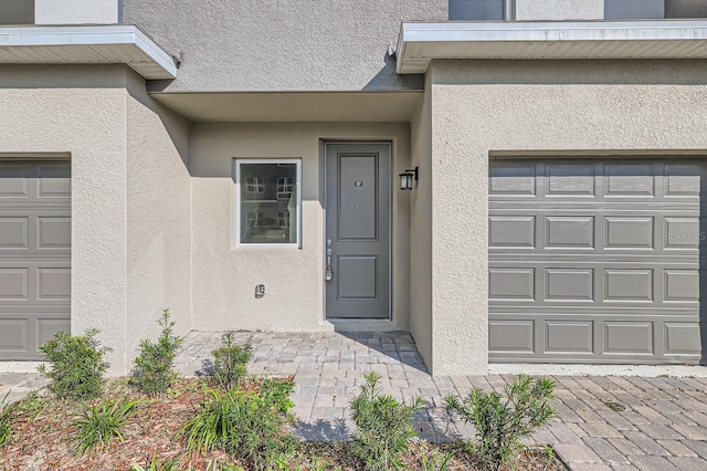 1209 S Station Pl Unit 306, Orlando, FL 32809 - entrance to property with a garage and stucco siding