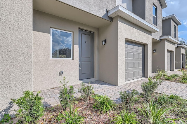 1209 S Station Pl Unit 306, Orlando, FL 32809 - entrance to property featuring a garage and stucco siding
