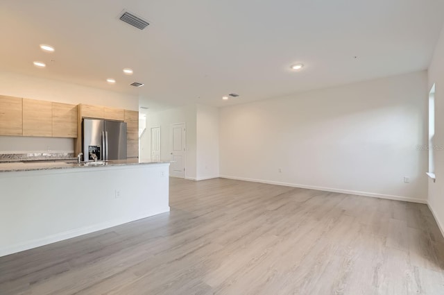 1209 S Station Pl Unit 306, Orlando, FL 32809 - unfurnished living room featuring light wood-type flooring, baseboards, visible vents, and recessed lighting
