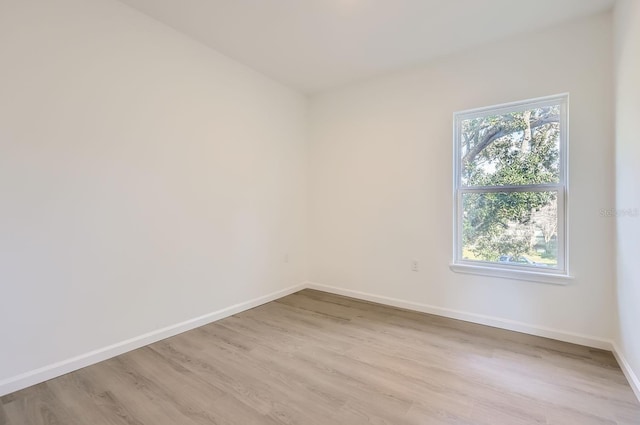 1209 S Station Pl Unit 306, Orlando, FL 32809 - spare room with light wood-type flooring and baseboards